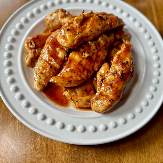 plate of delicious chicken tenders sauces with a combination of Sauce Goddess Sticky Sweet and Buffalo saucessauce
