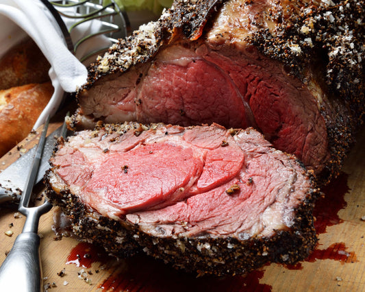 cutting board with Big Toms Steakhouse Prime Rib