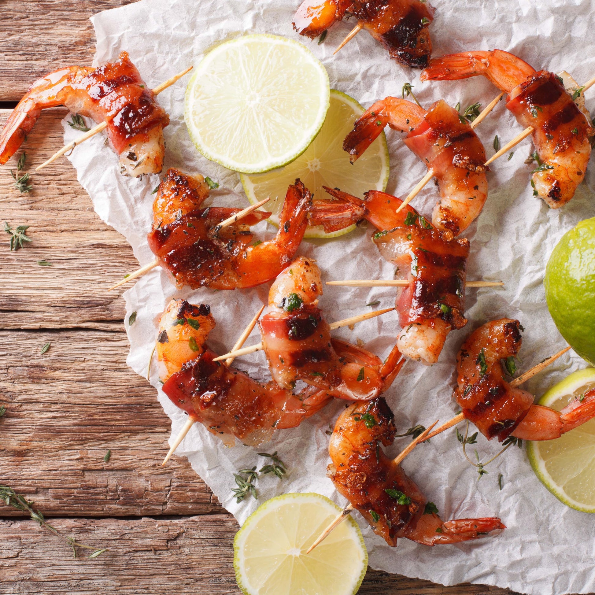 cutting board with bacon wrapped shrimp